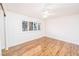 Bright bedroom with wood floors and a window with plantation shutters at 1561 Doran Dr, Las Vegas, NV 89123