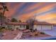 Charming single-story home with a three car garage and mature desert landscaping, creating great curb appeal at 1561 Doran Dr, Las Vegas, NV 89123