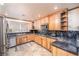 Beautiful kitchen featuring stainless steel appliances, granite counters, and wood cabinetry at 1561 Doran Dr, Las Vegas, NV 89123