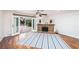 Bright living room with hardwood floors, fireplace, and glass doors leading to the outdoor patio at 1561 Doran Dr, Las Vegas, NV 89123