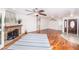Open living room featuring wood floors, a fireplace, and a decorative front door at 1561 Doran Dr, Las Vegas, NV 89123
