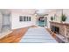 Bright living room boasts hardwood floors, stone fireplace, and backyard access to the pool at 1561 Doran Dr, Las Vegas, NV 89123