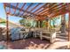 Inviting outdoor kitchen featuring stainless steel appliances and a pergola covered in clear material at 1561 Doran Dr, Las Vegas, NV 89123