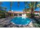 Lush backyard with a sparkling pool, mature trees, and privacy for year-round enjoyment at 1561 Doran Dr, Las Vegas, NV 89123