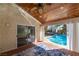 Inviting sunroom opens to a refreshing pool area, perfect for relaxation and outdoor enjoyment at 1561 Doran Dr, Las Vegas, NV 89123
