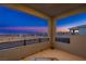 This balcony features stunning views of the city and mountains at twilight at 1592 Pacific Baza St, Las Vegas, NV 89138