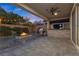 Relaxing covered patio features a built-in grill and a cozy stone fire pit, perfect for outdoor entertaining at 201 White Mule Ave, Las Vegas, NV 89148