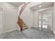 Open foyer with staircase, neutral tones, and marble floors that leads into the living spaces of the home at 201 White Mule Ave, Las Vegas, NV 89148