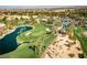 Breathtaking aerial perspective of a meticulously manicured golf course with scenic ponds and towering palm trees at 201 White Mule Ave, Las Vegas, NV 89148