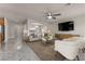 Comfortable living room featuring modern furnishings, a large television, and sleek flooring, creating a relaxed atmosphere at 201 White Mule Ave, Las Vegas, NV 89148