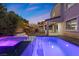 Beautiful backyard pool and spa with a covered patio, BBQ grill, and outdoor lighting for evening enjoyment at 201 White Mule Ave, Las Vegas, NV 89148