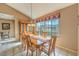 The dining room has tile flooring, a large window and a decorative light fixture at 213 N Cimarron Rd, Las Vegas, NV 89145