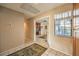 Hallway featuring neutral colored walls and tile flooring at 213 N Cimarron Rd, Las Vegas, NV 89145