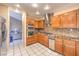 Modern kitchen with stainless steel appliances, ample cabinet space, and tile backsplash at 213 N Cimarron Rd, Las Vegas, NV 89145