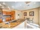 Spacious kitchen with stainless steel appliances, granite countertops, and tile flooring at 213 N Cimarron Rd, Las Vegas, NV 89145