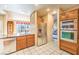 Well-appointed kitchen with stainless steel appliances, plenty of cabinets, and tile flooring at 213 N Cimarron Rd, Las Vegas, NV 89145