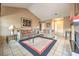 Inviting living room with vaulted ceilings, tile flooring, and stylish furniture at 213 N Cimarron Rd, Las Vegas, NV 89145