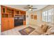 This living room has built-in shelving, tile floors and natural light at 213 N Cimarron Rd, Las Vegas, NV 89145