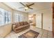 Bright living room featuring tile floors, a ceiling fan and natural light at 213 N Cimarron Rd, Las Vegas, NV 89145