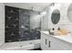 A modern bathroom boasts a glass-enclosed shower and geometric black and white tiling at 2205 Santa Clara Dr, Las Vegas, NV 89104