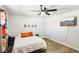 This room features a ceiling fan, wood-look floors, TV and framed pictures at 2205 Santa Clara Dr, Las Vegas, NV 89104