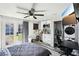 Bedroom with private outdoor access features a ceiling fan, kitchenette and a laundry closet at 2205 Santa Clara Dr, Las Vegas, NV 89104