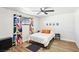 Bedroom with bright curtains, wood-look flooring, and a comfortable bed at 2205 Santa Clara Dr, Las Vegas, NV 89104