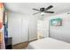 Bright bedroom features a ceiling fan, wood-look floors and an entertainment center at 2205 Santa Clara Dr, Las Vegas, NV 89104