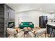 Bright living space with a modern fireplace, comfortable seating, and an open kitchen area at 2205 Santa Clara Dr, Las Vegas, NV 89104