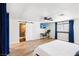 A brightly lit main bedroom features wood floors, an en suite bathroom, and a ceiling fan at 2205 Santa Clara Dr, Las Vegas, NV 89104