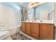 Bathroom featuring a double sink vanity with oak cabinets and a shower-tub combination at 2245 Saint Paul Way, Las Vegas, NV 89104