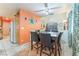 Bright dining area featuring oak cabinets, white appliances, tile flooring, and modern decor at 2245 Saint Paul Way, Las Vegas, NV 89104