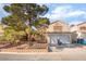 Charming two-story home with a well-manicured front yard and a convenient two-car garage at 2245 Saint Paul Way, Las Vegas, NV 89104