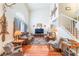 Inviting living room featuring high ceilings, hardwood floors, and a cozy seating area with leather sofas at 2245 Saint Paul Way, Las Vegas, NV 89104