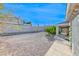 View of the backyard featuring open space, some greenery, and a portion of the house at 241 E Country Club Dr, Henderson, NV 89015