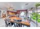 Inviting dining area with a large window and garden views, adjacent to the kitchen at 241 E Country Club Dr, Henderson, NV 89015