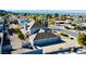 Exterior shows a home with a three-car garage, fenced yard and mature landscaping at 241 E Country Club Dr, Henderson, NV 89015