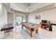 Well-lit game room features a pool table and tile flooring at 241 E Country Club Dr, Henderson, NV 89015