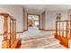 Hallway with decorative wood trim, built-in shelving, and an open view into the bedroom with fireplace at 241 E Country Club Dr, Henderson, NV 89015