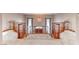 Hallway with curved wood railings showcasing the main entry with decorative glass front door and chandelier at 241 E Country Club Dr, Henderson, NV 89015