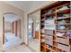 Hallway view with sliding closet doors and neutral carpeting at 241 E Country Club Dr, Henderson, NV 89015