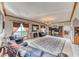 Open living room featuring large decorative rug, fireplace and chandelier at 241 E Country Club Dr, Henderson, NV 89015