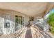Covered outdoor patio area with concrete flooring and access to the home's interior at 241 E Country Club Dr, Henderson, NV 89015