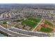 Wide aerial view of a community with recreational facilities including tennis courts, and baseball field at 2653 Rimbaud St, Henderson, NV 89044