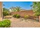 Backyard featuring a brick fence, palm trees and a patio dining set at 2653 Rimbaud St, Henderson, NV 89044
