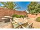 Backyard with brick patio, grill, and a dining table and chairs at 2653 Rimbaud St, Henderson, NV 89044