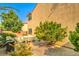 Spacious backyard featuring a brick patio and a wooden dining set at 2653 Rimbaud St, Henderson, NV 89044