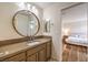 Bathroom features a large mirror over the vanity and access to the bedroom at 2653 Rimbaud St, Henderson, NV 89044