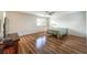 Bright bedroom features a ceiling fan and hardwood floors at 2653 Rimbaud St, Henderson, NV 89044
