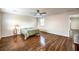 Spacious bedroom features natural light, a ceiling fan, and hardwood floors at 2653 Rimbaud St, Henderson, NV 89044